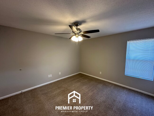 Building Photo - Spacious 4BR/2BA Home in 38141 | Vinyl Flooring & Large Fenced Backyard