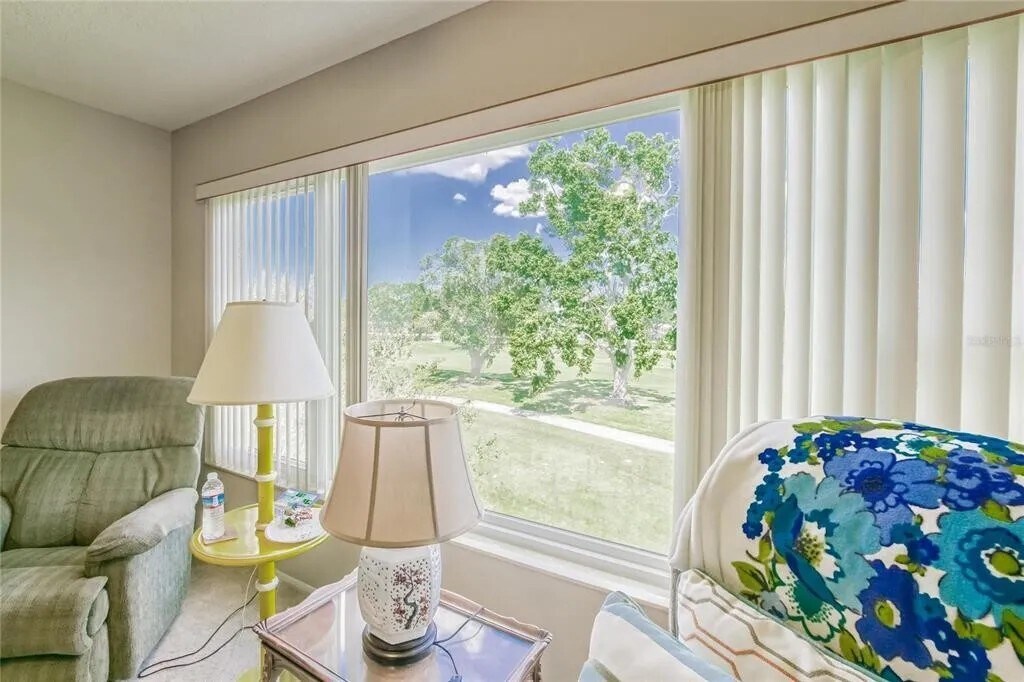 Florida room with picture window view of golf course - 2460 Franciscan Dr
