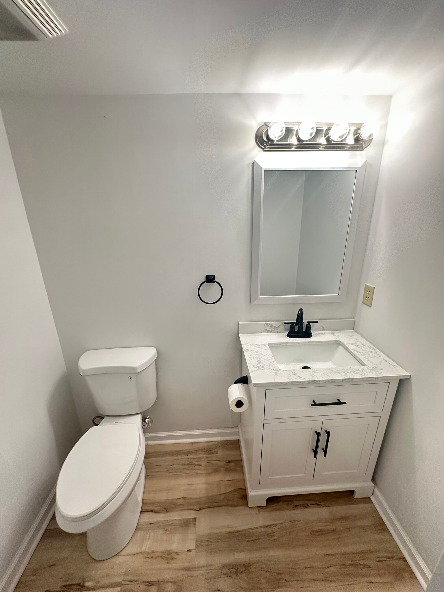 Half bath downstairs off living room - 910 Dolphin Ct
