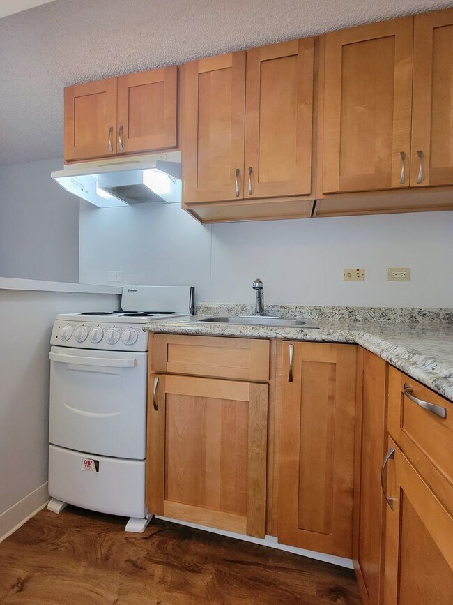 Building Photo - For Rent | Full Size Studio Apartment with...
