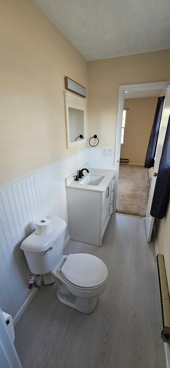 Half Bathroom with view of Back/Master Bedroom. Please note that rooms are larger than they appear d - 578 Tyler St