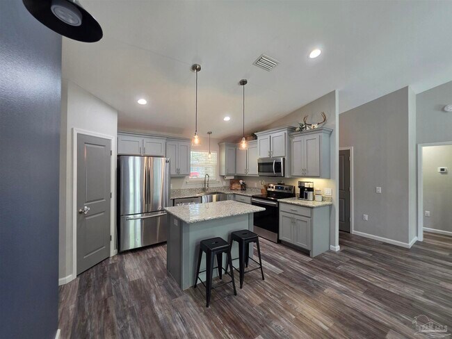 Building Photo - 5565 Riviera Dr