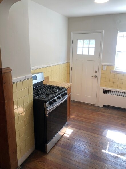 Kitchen with private rear entrance - 1711 Portman Ave