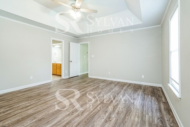 Building Photo - The living is easy in this 4 bedroom, 2.5 ...