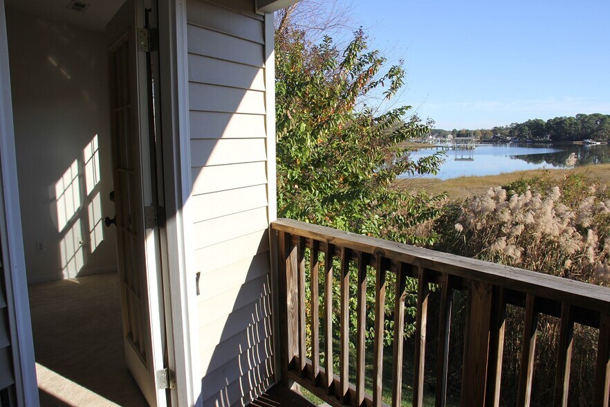 Master bedroom and Water View from Balcony - 148 River Walk Ct