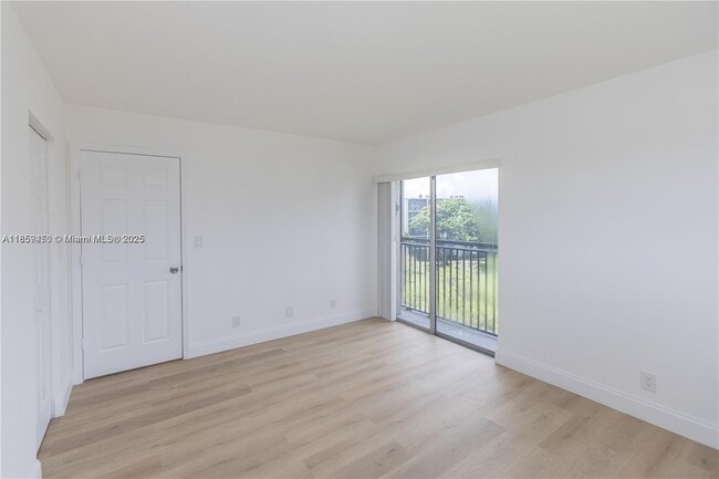 Building Photo - $2,100MONTHLY;8740 N SHERMAN CIR. #408 MIR...
