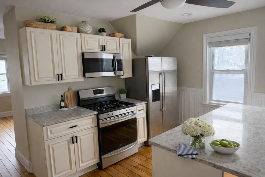 Eat in dining room w/ a 7’ x 4’ granite center island (AI staged furnishings) - 16 Tecumseh Street