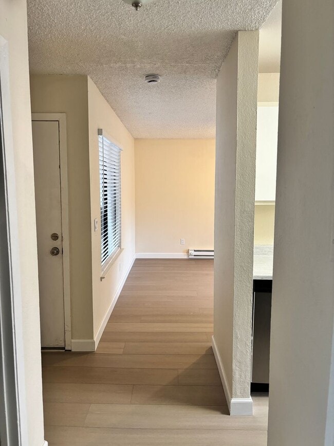 Building Photo - NEWLY REMODELED CONDO - 1 BED/1 BATH UPSTA...