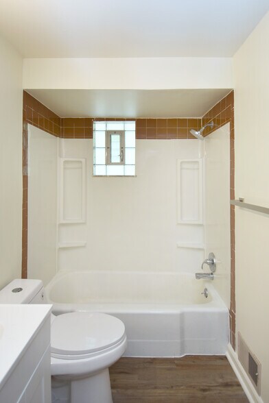 Bathtub has new faucet fixtures and towel bars throughout. - 3156 Glendale Ave
