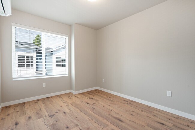 Building Photo - NEW CONSTRUCTION – Stylish 4-Bedroom Townh...