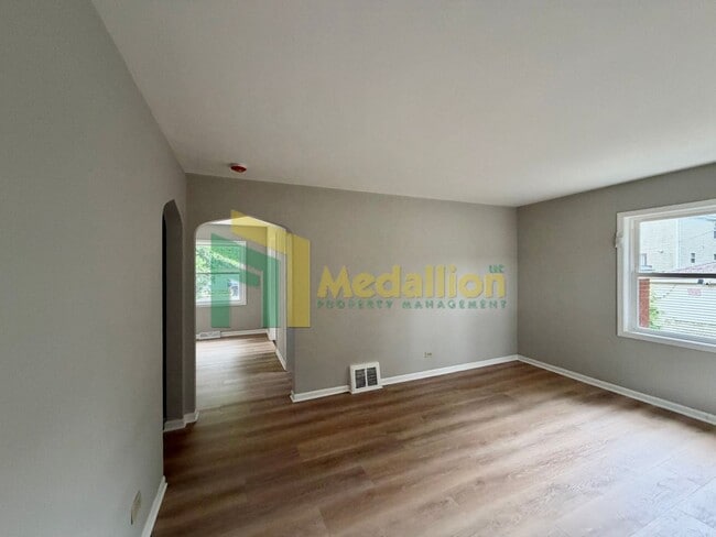 Building Photo - Updated 4-Bedroom Home with Bonus Living Space