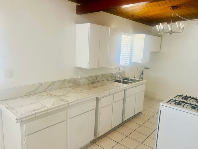 Building Photo - Charming 3-Bedroom Home with Wood Ceilings...