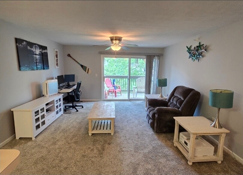 Living Room with Private Balcony - 240 Legends Creek Pl