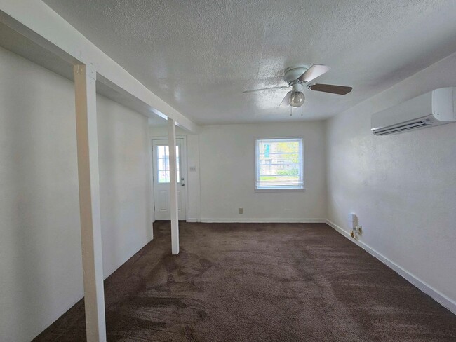 Building Photo - Cozy 2 Bed, 2 Bath Home with Parking Spaces and a Fenced Backyard!