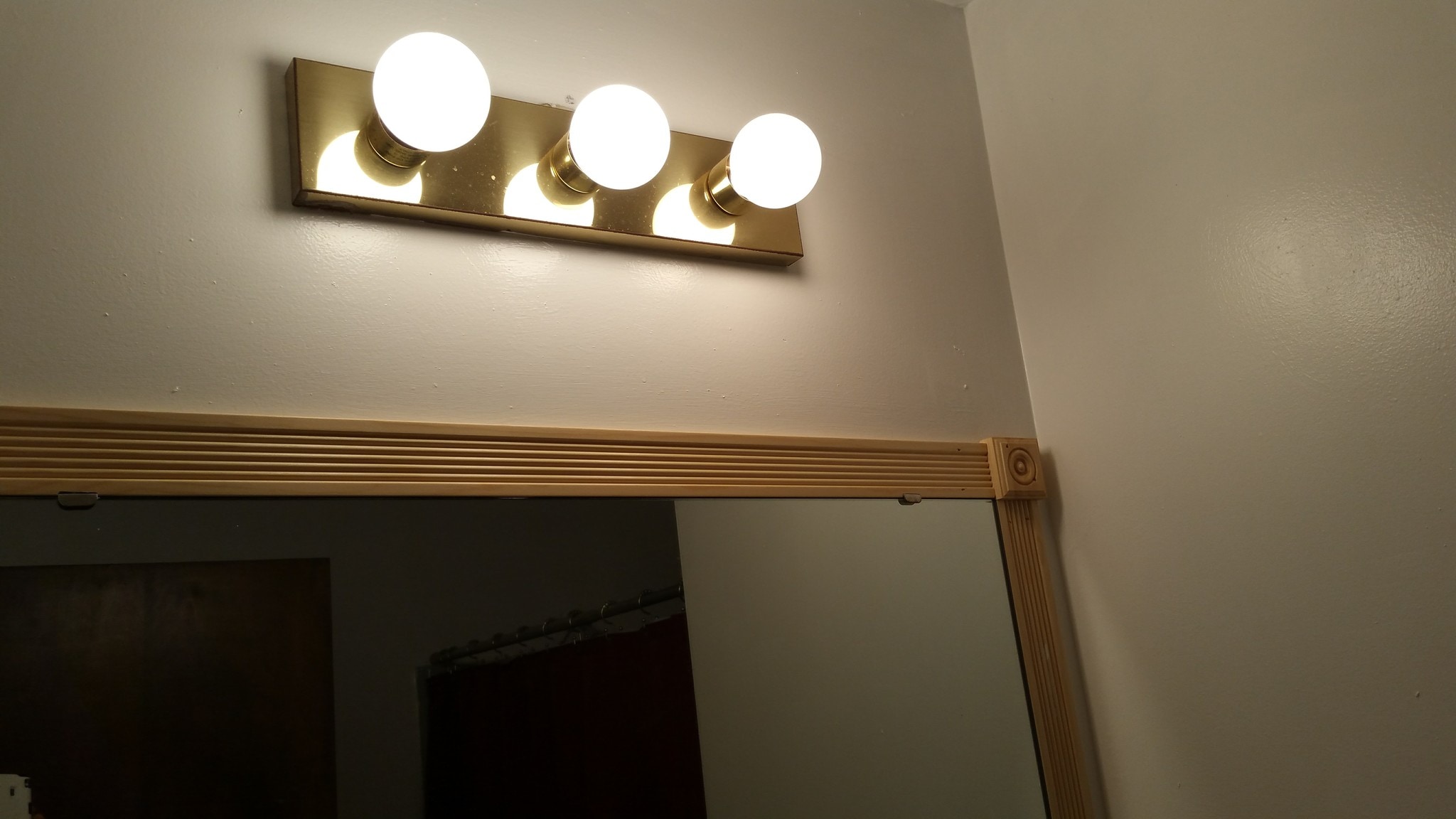 Shared bathroom lighting fixture - 2116 Thaler Ave