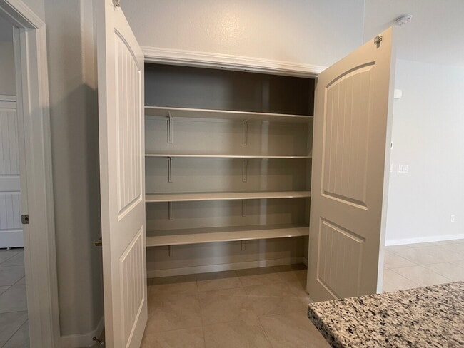 Building Photo - 4 BED 2 BATH 2 CAR GARAGE SINGLE STORY SINGLE FAMILY HOME w/ PAVED BACKYARD IN CADENCE COMMUNITY,...