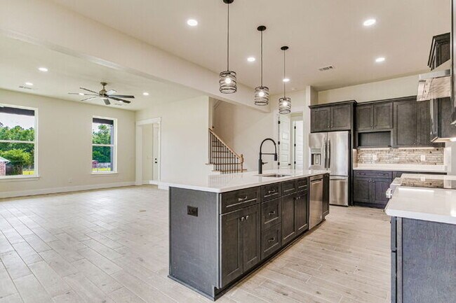 Building Photo - This luxurious new custom home in the sought-after Shadow Grove subdivision is a masterpiece of m...