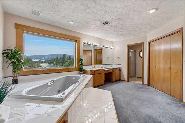 Building Photo - Stunning Home Along Spokane River Complete...