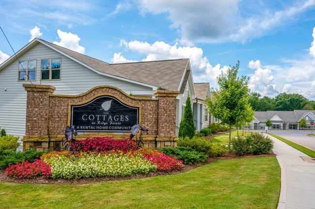 Exterior shot of the entrance to the property. - Cottages at Ridge Pointe