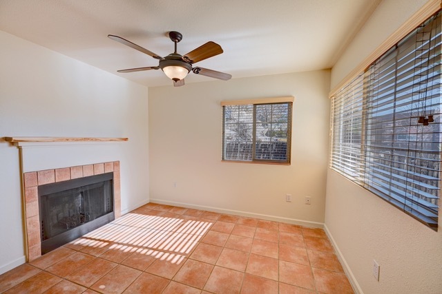 Unit 1011--Front room with fireplace bathed with natural light - 2210 Miguel Chavez Rd