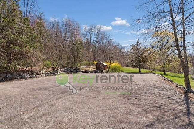 Building Photo - Charming 4-Bedroom Home on 2 Acres—Woods, Trails & Exceptional Storage