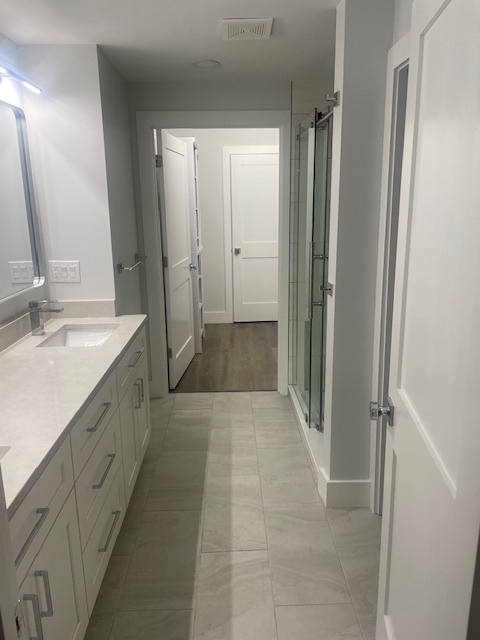 Primary Bathroom & Entry to Walk-in Closet - 50 E McMicken Ave