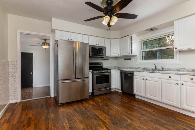 Kitchen leads into breezeway - 7923 S Rock Hill Rd