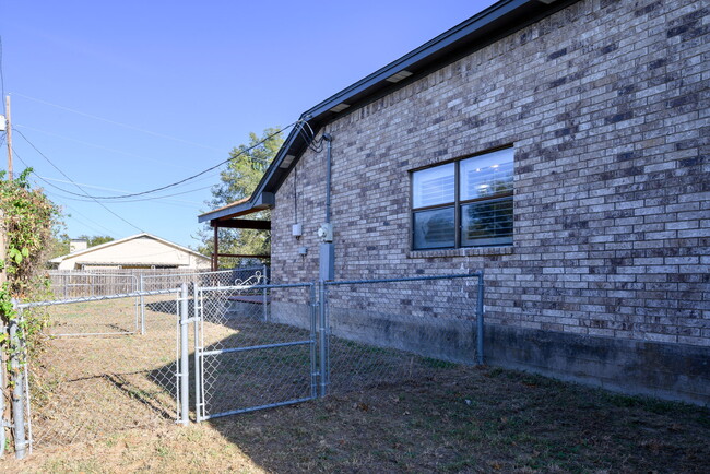 Side view of the backyard. - 209 Prairie Wind Blvd