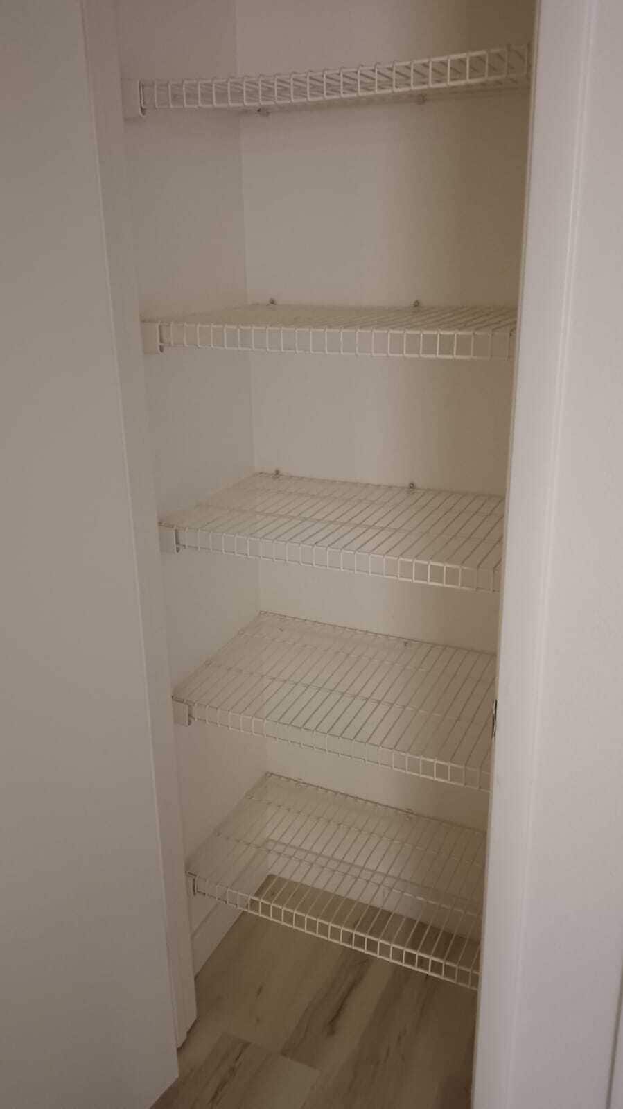 Hallway closet - 1901 Villa Palms Ct