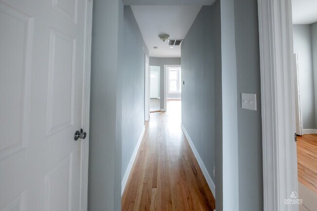 Building Photo - Modern 4BR Apartment with Hardwood Floors, Balcony & Central A/C