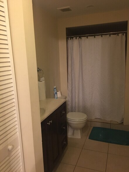 bathroom with new tile and vanity - 450 NW 20th St