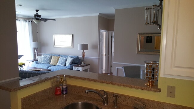 kitchen looks to dining and family are - 1600 Long Grove Dr