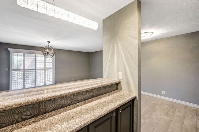 Building Photo - GATED COMMUNITY CONDO WITH BRAND NEW UPGRA...