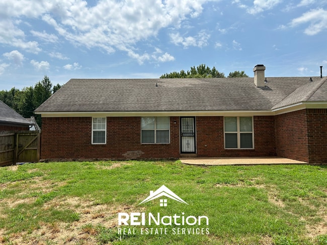 Building Photo - Spacious 4BR/2BA Near Southwind | High Ceilings, Brick Fireplace & 2-Car Garage