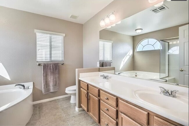 Building Photo - Two-story 4 BR & 3 BA designs offer luxuri...