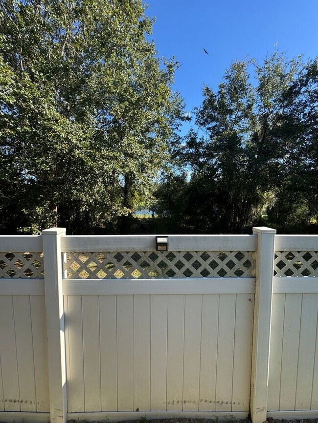 Building Photo - COMING SOON! Beautiful 4BR 3BA Home w/ Screened Lanai & Pond View • Garage Parking • Fenced Yard ...