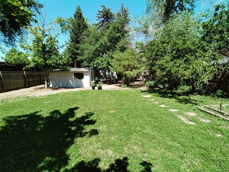 backyard from bocce court looking at garage and house - 1618 Person Ct