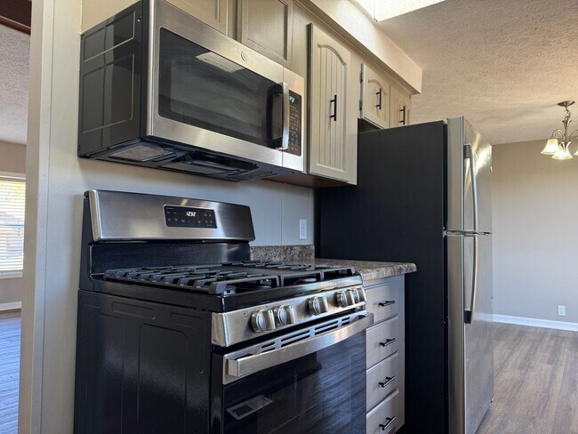 Building Photo - Bright and spacious split-entry home with a finished lower level, large yard, and plenty of updates!