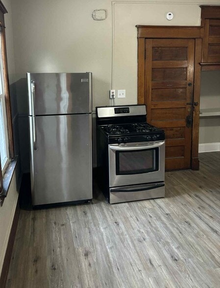 stainless steel fridge and gas over/stove - 633 E Burleigh St