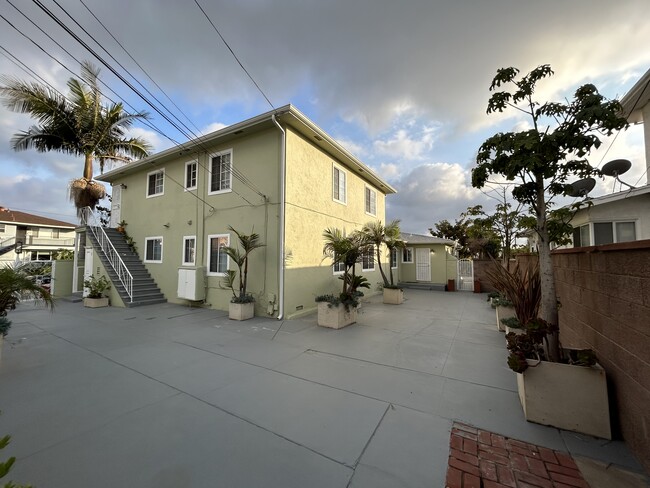 Rear entry door from garage through courtyard - 5303 W Slauson Ave