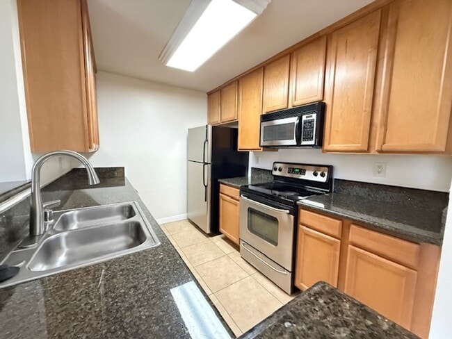 Building Photo - Resort-Style 2BR/2BA First-Floor Condo in Gated Lucera Community Near UTC