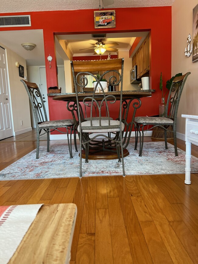 Beautiful hardwood floors throughout main area and bedroom - 6219 Palma Del Mar Blvd S