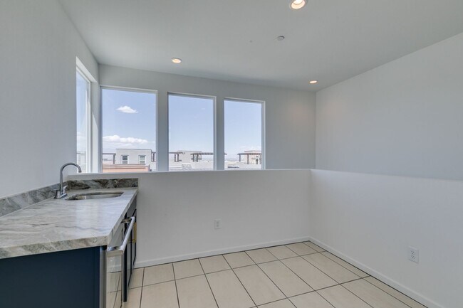 Building Photo - Stunning 4-Level Townhome in Inspirada | R...