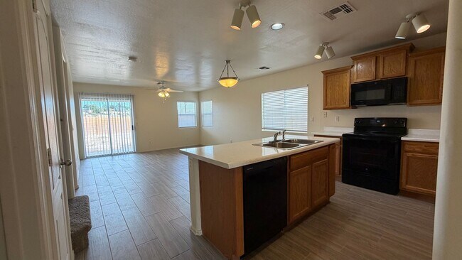 Building Photo - Two Story Home with NEW tile and a large backyard!