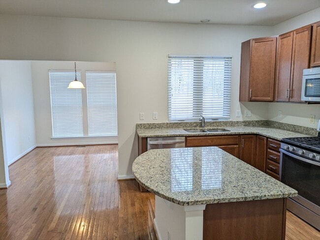 Building Photo - Brambleton Elegance: A Spacious Townhome Oasis