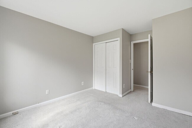 Building Photo - Contemporary design meets exceptional space in this inviting ground level residence, offering eff...