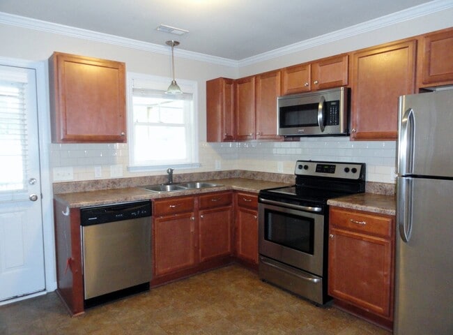 Building Photo - End Unit with Lots of Upgrades!