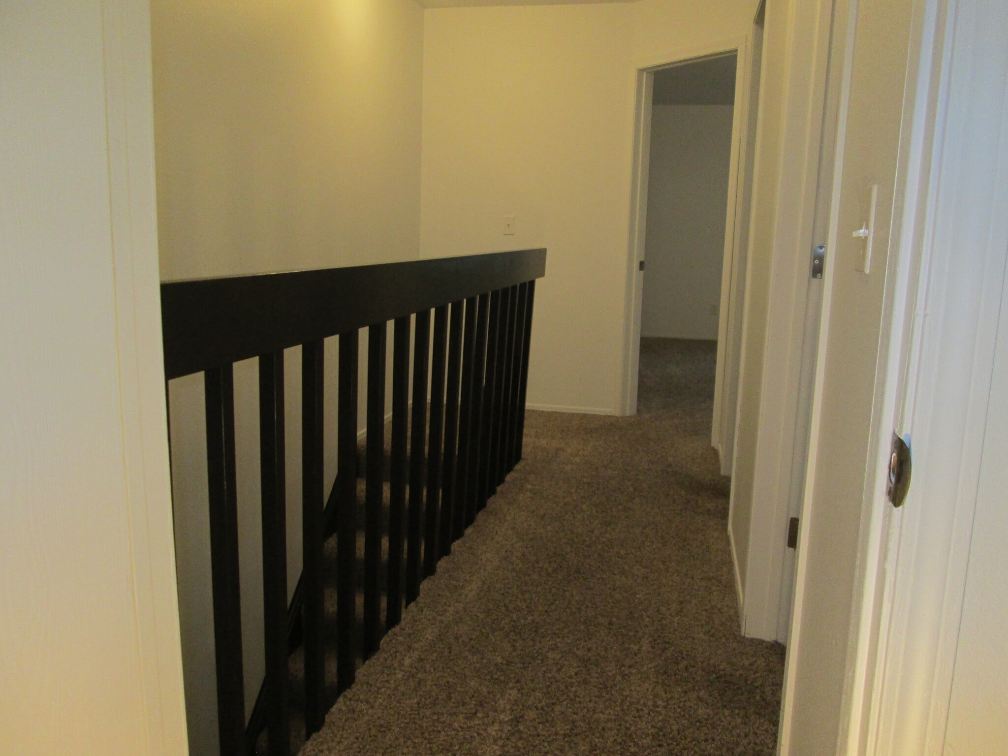 Upstairs hallway with refinished woodwork. - 1440 Edora Rd