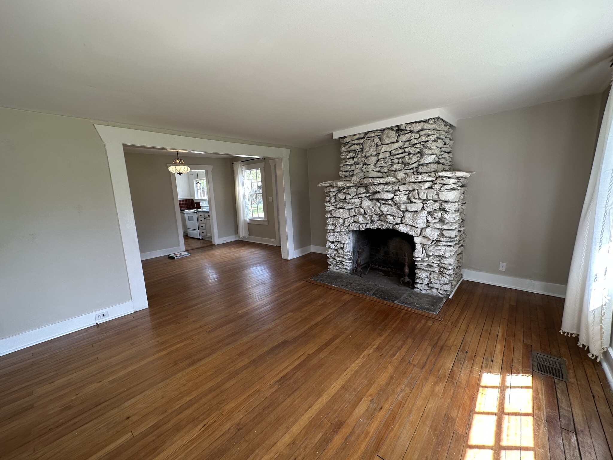 The living room flows to the dining room and kitchen - 1148 Pierce Rd