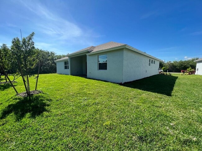 Building Photo - This Charming Brand-New Home is a 4/3 with...